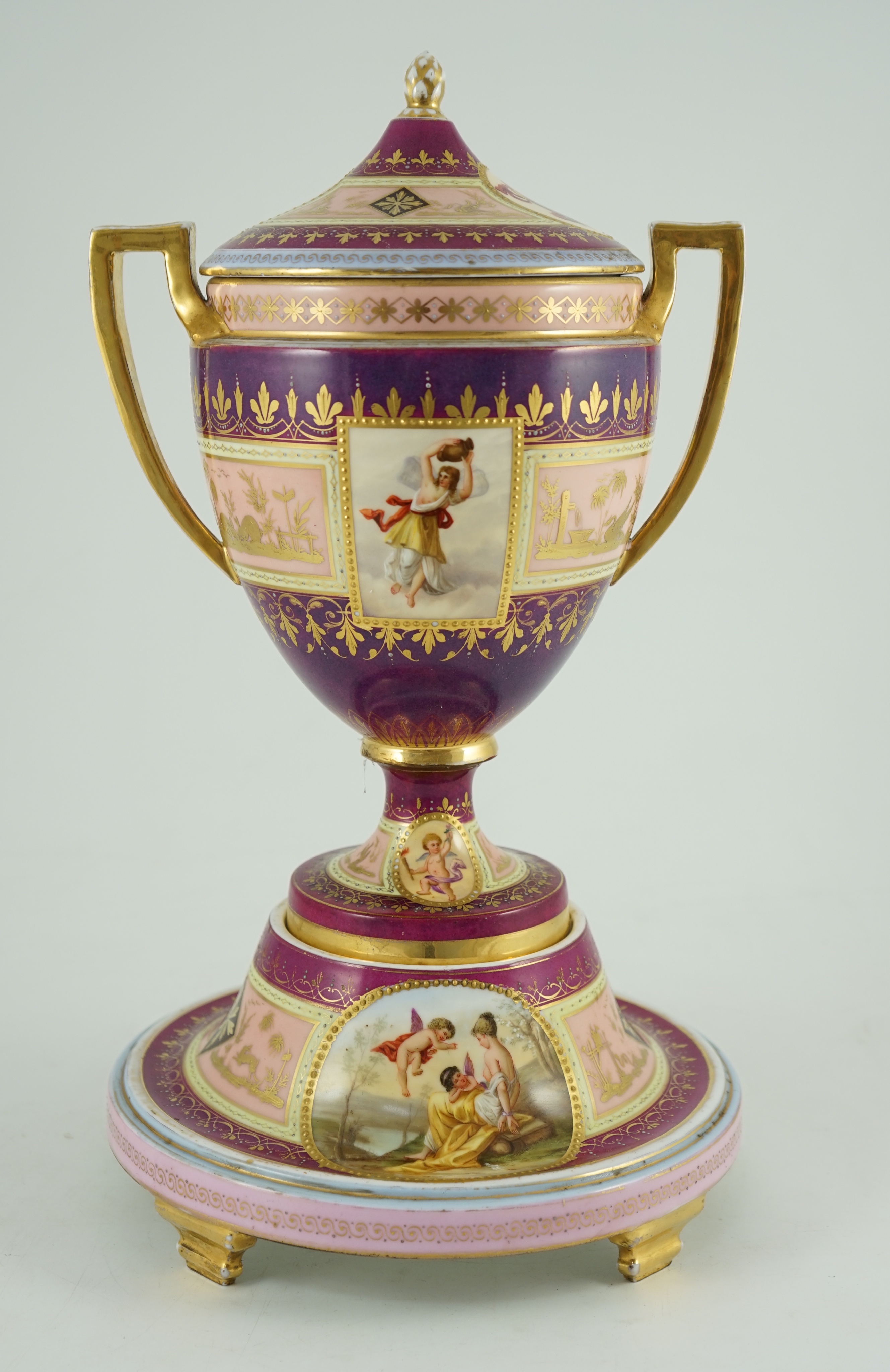 A Vienna style porcelain two handled cup, cover and stand, late 19th century, 42 cm high